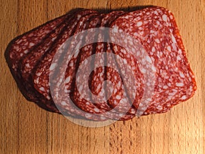 A few slices of appetizing serverlata on a wooden board