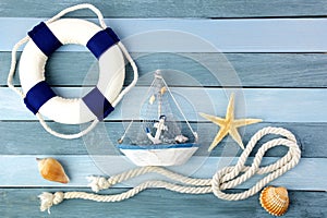 Few summer marine items on a wooden background.
