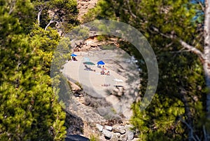 A few vacationers laying on the beach