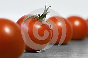 A few red ripe tomatos on a table for healthy nutrition