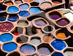 Fez is also famous for its old leather Tanneries. Old tanks of the Fez`s tanneries with color paint for leather, Morocco, Africa. photo