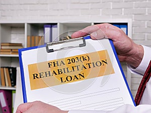 FHA 203k rehabilitation loan application for signing.