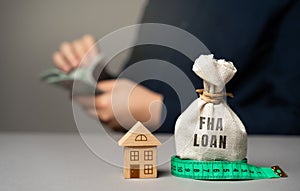 FHA loan concept. Mortgage insured by Federal Housing Administration Loan. Affordable loans for borrowers photo