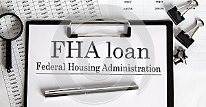 FHA loan form on a chart with pen and office tools