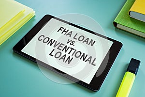 FHA loan vs Conventional loan choice for mortgage on screen. photo