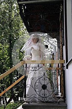 Fiancee on the porch of the house