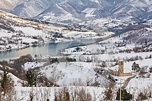 Fiastra lake with snow on the national park of Sibillini mountains photo