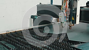The fiber laser cutting machine cutting machine cut the metal plate. The hi-technology sheet metal manufacturing process