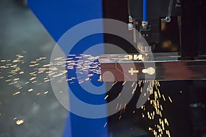 The fiber laser cutting machine cutting the stainless steel tube control by CNC program.