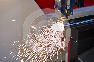 The fiber laser cutting machine cutting the stainless steel tube control by CNC program