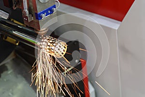 The fiber laser cutting machine cutting the steel pipe