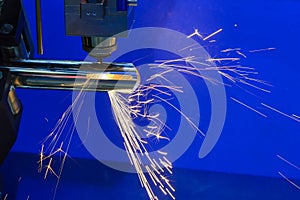 The fiber laser cutting machine cutting the steel pipe