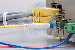 Fiber optic cable and network ethernet patch cord connect to the switch
