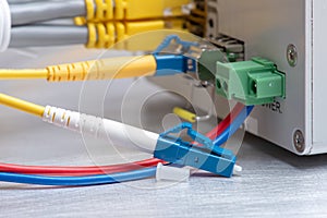 Fiber optic cable and network ethernet patch cord connect to the switch