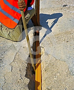 Fiber optic cables buried in a micro trench