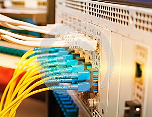 Fiber Optic cables connected to optic ports and UTP