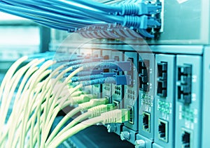 Fiber Optic cables connected to optic ports and UTP