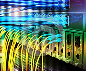 Fiber Optic cables connected to optic ports and UTP