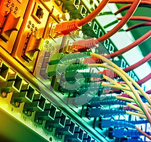 Fiber Optic cables connected to an optic ports and UTP Network cables