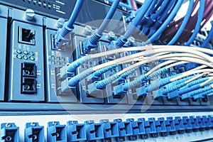 Fiber Optic cables connected to an optic ports and UTP Network cables