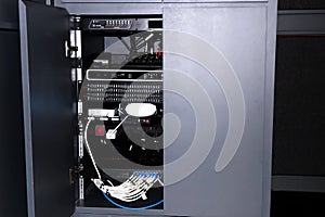 Fiber Optic cables connected to a power supply cabinet in a data center