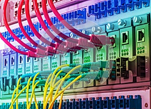 Fiber Optic cables and UTP Network cables connected hub ports.