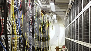 Fiber optic equipment in a data center, IT and modern technologies concept. Stock footage. Server room routers and fiber