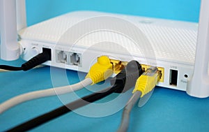 Fiber Optic Internet. Network cables Connected to a router. Wireless internet router with connected cables. Internet security.