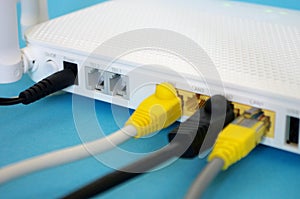 Fiber Optic Internet. Network cables Connected to a router. Wireless internet router with connected cables. Internet security.