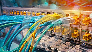 Fiber Optical cables connected to an optic ports and Network cables connected to ethernet