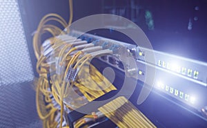 Fiber optical cables patch panel and switch.