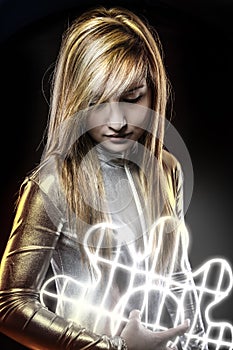 Fiber optics concept, future blonde dressed in silver