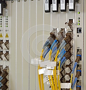 Fiber Optics with SC/LC connectors. Internet Service Provider equipment. Focus on fiber optic cables. Data Network Hardware