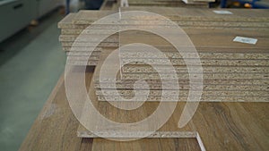 Woodworking industry and furniture assembly concept. Fiberboard at a furniture factory. Boards at the factory close-up. Fragment