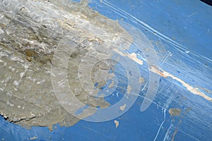 Fiberglass Crack Repair on a Blue Boat Hull