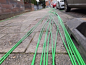 Fibre optic cables ready on the pavement to be buried for high-speed internet