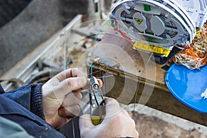 Fibre optic technician preparing the fibers