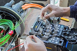 Fibre optic technician splicing fibers 2 photo