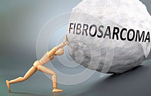 Fibrosarcoma and painful human condition, pictured as a wooden human figure pushing heavy weight to show how hard it can be to