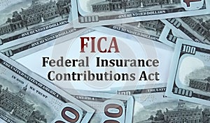 FICA - acronym on the background of cash dollar bills