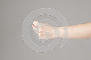 Fico gesture of a hand on a white background