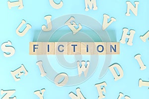 Fiction narrative form in english literature concept. Wooden blocks typography word flat lay