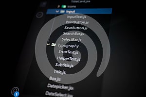 Fictional file directory mockup in dark-themed code editor showing a list of JavaScript UI component filenames, ideal for