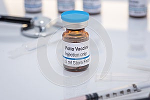 A fictional Polio vaccine vial with stethoscope and syringe