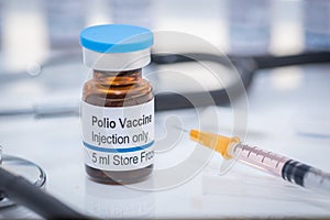 A fictional Polio vaccine vial with stethoscope and syringe