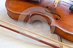 Fiddle bout and bow on music book