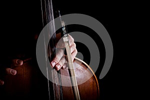 Fiddlestick in hand cellist