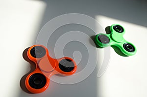 Fidget finger spinner stress, anxiety relief toy on table