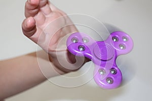 Fidget spinner. Colorful fidget spinner. Kids playing with fidget spinner. Kids relaxing.