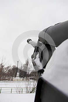 Field gun covered with snow aiming to the sky